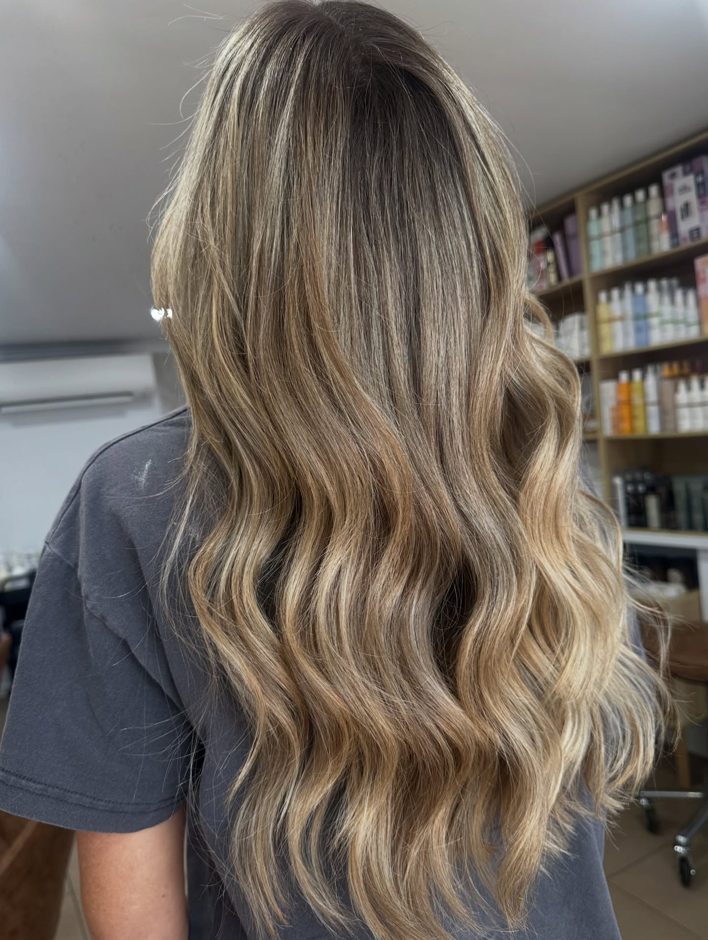 Lived-in colour waves hairstyle showcasing professional hair education results