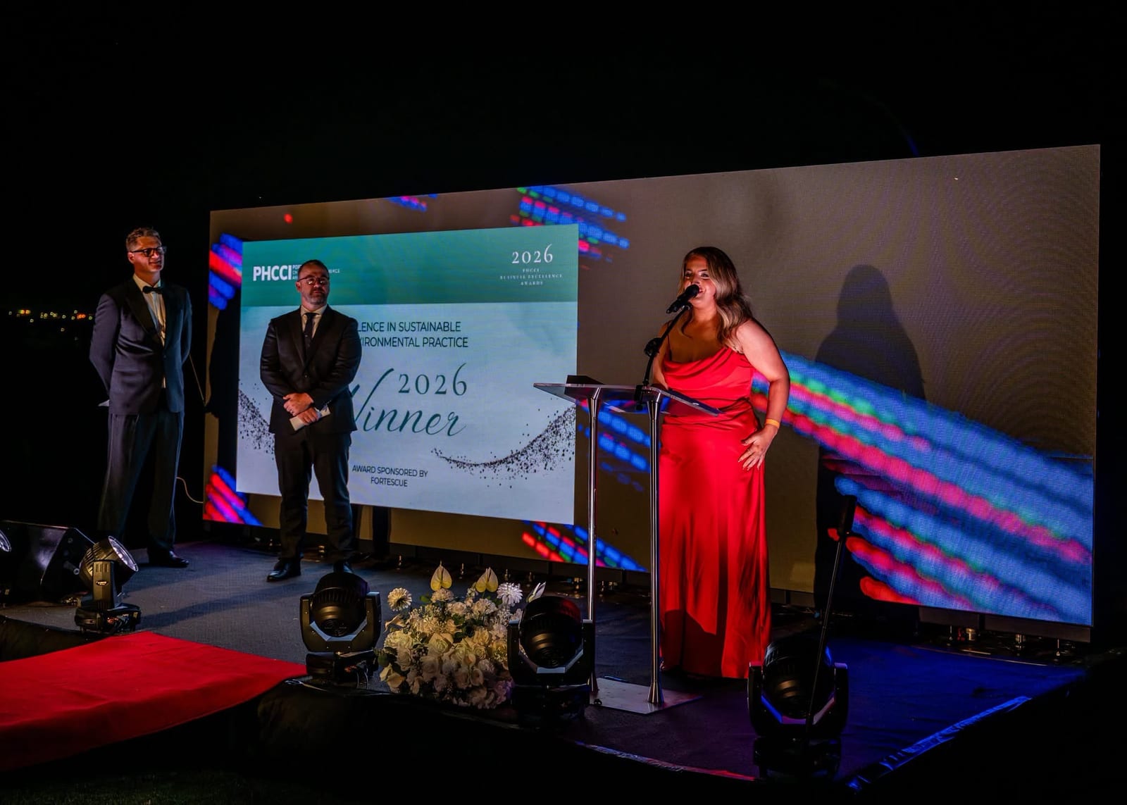 Kate Bonnie on stage as the 2026 Winner of the Excellence in Sustainable and Environmental Practice award, sponsored by Fortescue