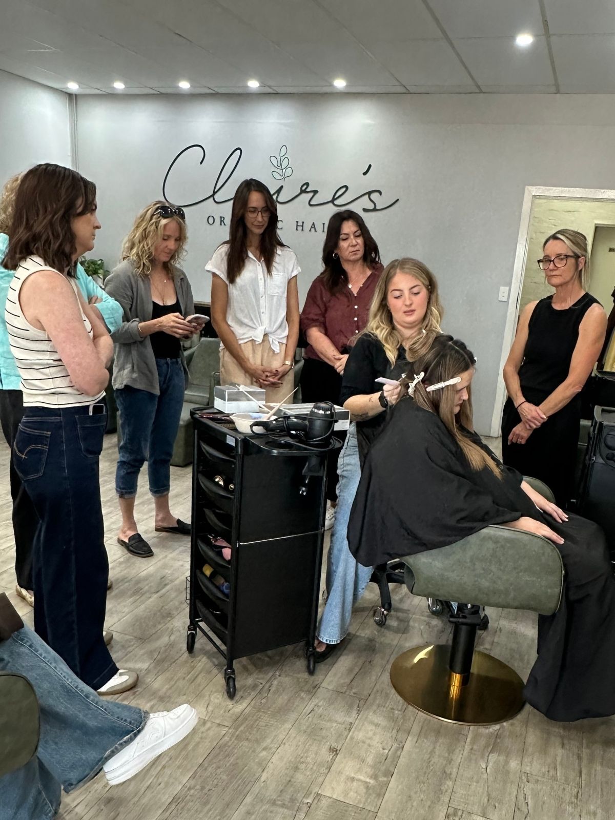 Kate Bonnie demonstrating lived-in hair colour technique to stylists during education class in Mandurah, Perth