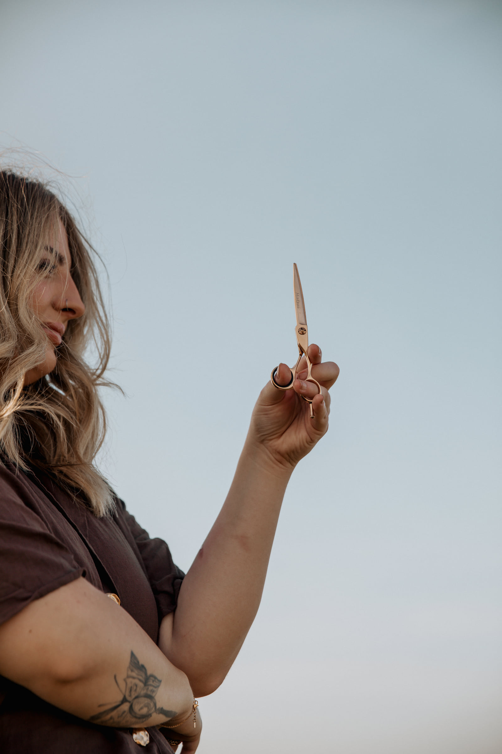 Kate Bonnie hairdresser holding professional hair scissors in Pilbara South Hedland
